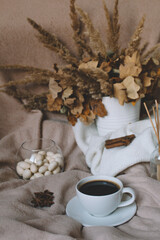 A cup of coffee in a cozy atmosphere