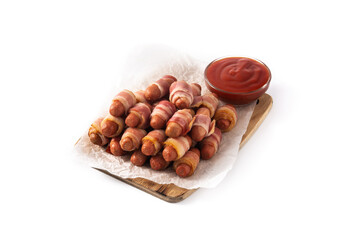 Pig in blankets. Sausages wrapped in smoked bacon isolated on white background