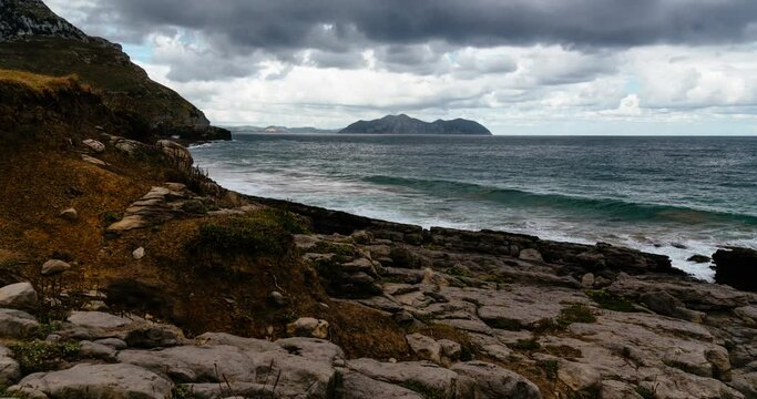 Daytime Timelapse Of Moving Waves and Clouds Over Atlantic Ocean in the coast of Cantabria