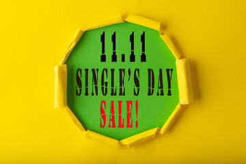 11.11 Single day sale. Yellow circle torn paper with 11.11 Single days sale on Green color background
