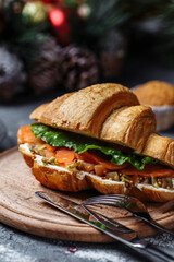New Year's breakfast with croissants. New Year's croissant with red fish and avocado. New Year and Christmas concept
