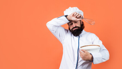 tired brutal hipster in apron finished cooking meal. time for eating. hard baking. concept of housekeeping. mature bearded man wear chef hat. male cook ready for preparing food. exhausted and tired