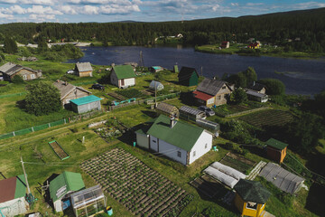 Fototapeta na wymiar Aerial Townscape of Suburban Village Kolvica located in Northwestern Russia on the Kola Peninsula Kandalaksha Area