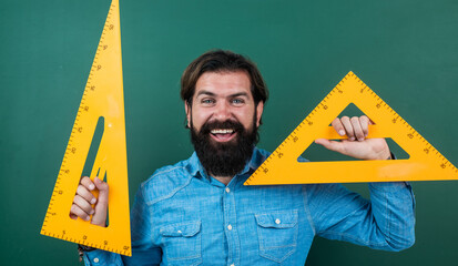 man happy with size measured on triangle ruler math tool, math school
