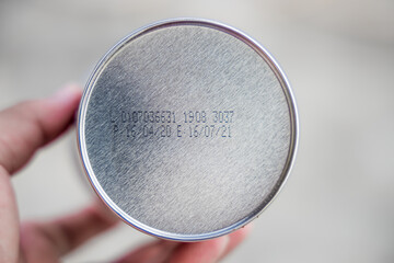 Packaged Date and Expire Date information on the bottom of the canned frozen food.