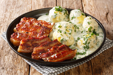 Crispy fried pork belly with creamy parsley sauce, or stegt flæsk med persillesovs, is a classic Danish dish