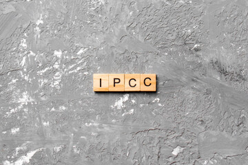 IPCC word written on wood block. abbreviation Intergovernmental Panel on Climate Change text on...
