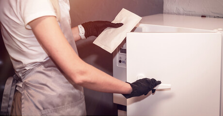 Equipment for sterile cleaning of working manicure tool. The process is carried out by a nurse in a sterile outfit manicure master, Long banner format. space for text