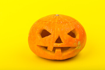 Glowing Halloween Pumpkin isolated on yellow background