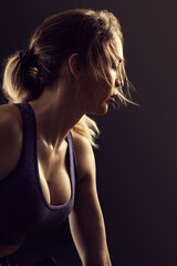 Obraz premium Slim beauty athletic woman on black background
