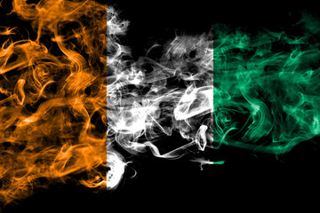 Ivory Coast smoke flag isolated on black background