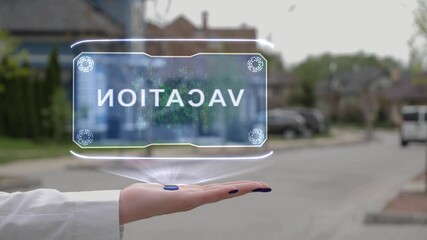 Female hand showing conceptual hologram with Vacation text. Unrecognizable woman in white holds future holographic technology on the background of a street with private houses - Powered by Adobe