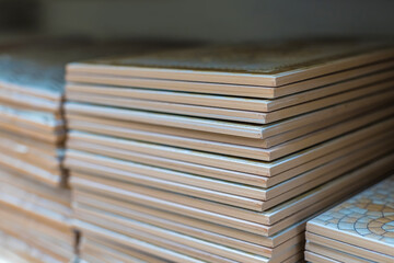 A stack of ceramic tiles for the bathroom floor or wall. The concept of finishing a bathroom in a hotel or house.