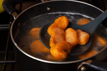 Fresh pumpkin gnocchi. Close-up. Homemade food. Orange