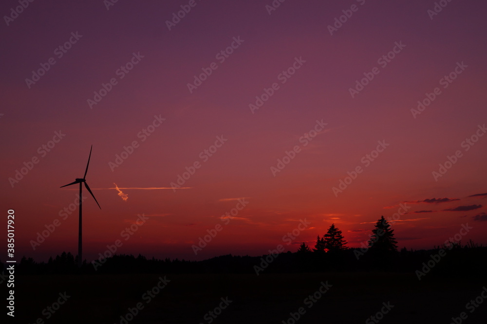 Wall mural wind turbine at sunset