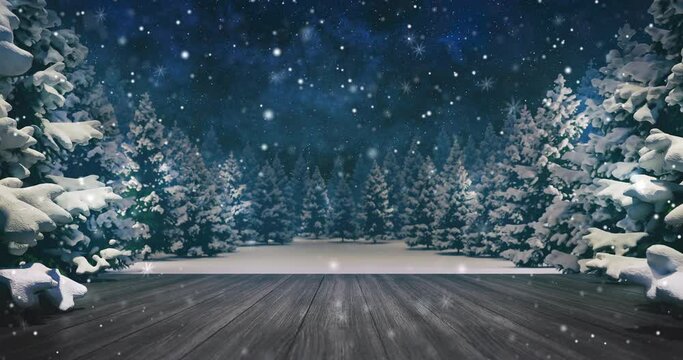 Falling snow over winter forest at stary night. Dark wooden deck for advertisement location. Winter landscape scene as 4k video loop.