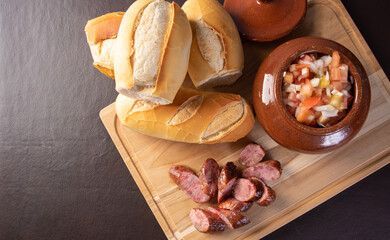 Breads, vinaigrette, sliced ​​roasted sausage on a table, Top view.