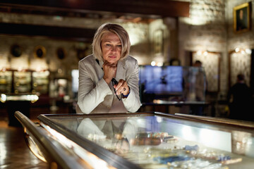 Woman exploring expositions in museum