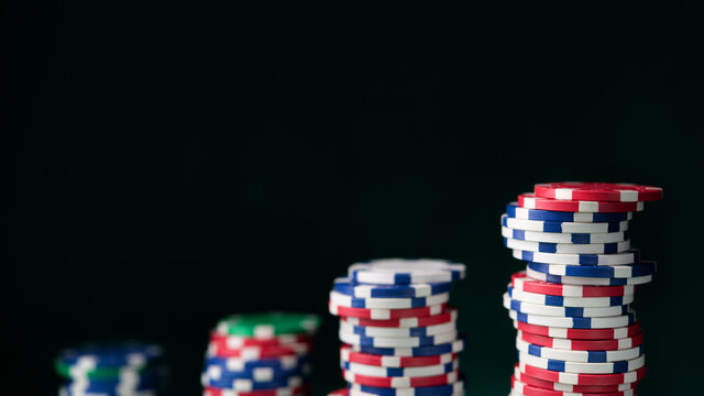 Stack chips poker on a table background
