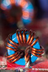 Close up of inductor copper coil on circuit board	