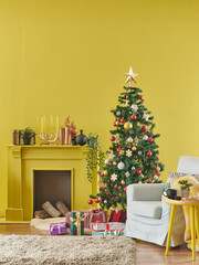 Decorative yellow interior room with Christmas tree, fireplace, clock and blue armchair. Happy new year concept.