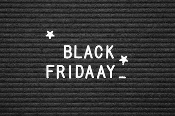 Board with text BLACK FRIDAY, closeup