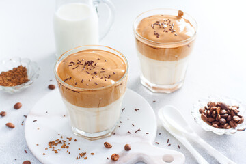 Cold drink with coffee, milk, sugar and water, dalgona coffee, horizontal