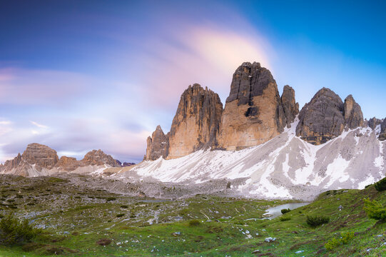 Sunset over Tre Cime di Lavaredo, Monte Paterno and Grava Longa lakes in summer, Sesto Dolomites Natural Park, South Tyrol, Italy