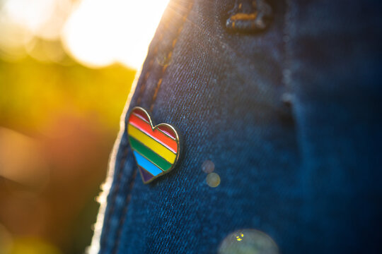 Rainbow color lgbt heart badge on jeans.