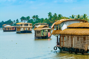 Kerala houseboats cruising Lake Vembanad, longest lake in India, during a backwater tour, Alappuzha (Alleppey), Kerala, India
