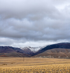 panoramic view of picturesque snowy mountains tops on blue sky background