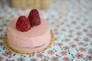 Pink mousse dessert with two of fresh berries
