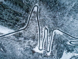 Seasons Concept winter snowy Aerial view Winding road serpentine mountain pass village Brodenbach Germany