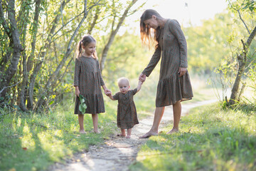 Fototapeta premium mom and two daughters
