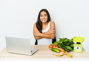 Young dietician asian woman isolated on white background going cold due to low temperature or a sickness.