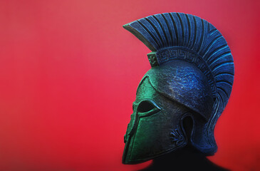 Ancient Spartan (Greek) warrior helmet on a red background with copyspace for text. Suitable for TV documentaries, history information etc. - obrazy, fototapety, plakaty