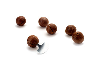 Macadamia nut , on a white background with shadows