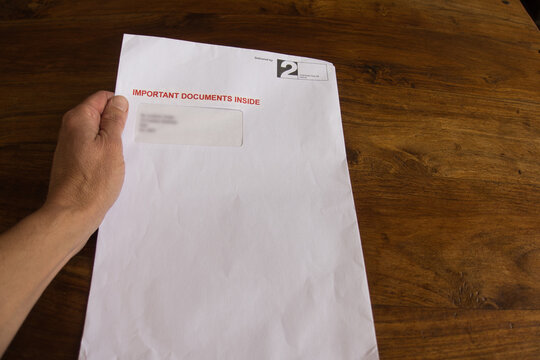 A second class A4 envelope marked with red words - Important Documents Inside'  - used to send out final demands, overdue bills and reminders of unpaid debt.