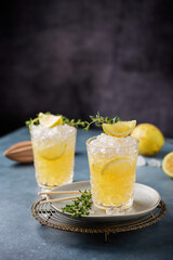 Cocktail with lemon, timo and crushed ice