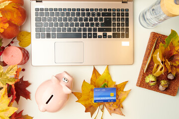 flat lay with notebook, leaves and chestnuts on white table