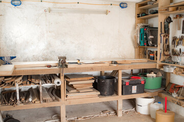 Various carpenter's tools and supplies in a garage.