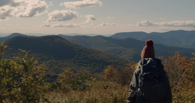 Female backpacker on Art Loeb trail in Appalachia on a beautiful fall day