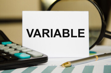 text The variable is written in a notepad. Variable universal life insurance. the text is written...
