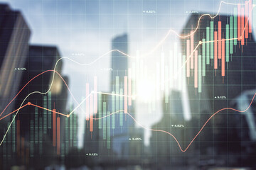 Double exposure of abstract financial graph on office buildings background, forex and investment concept