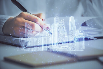 IOT drawing over writing hands in notepad background. Concept of smart home. Multi exposure