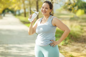 Fat woman and sports. Does exercise for weight loss in the fresh air. High quality photo. © nuzza11