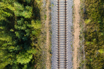 Railway through autumn forest. Aerial view