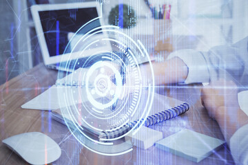 Multi exposure of woman hands on background with technology coding hologram. Data concept.