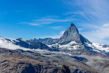 Fototapeta na wymiar Matterhorn Mountain with white snow and blue sky in summer in Switzerland