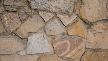 Texture of a wall lined with natural stone